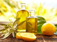 Massage oil bottles with lemons and olive branch